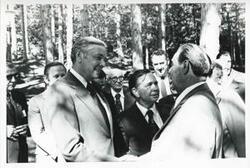 ["Black and white photograph print of Carl Albert standing outside with Leonid Brezhnev and several others. Yalta. August 1975"]