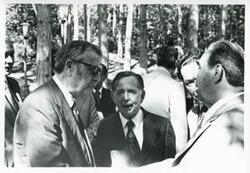 ["Black and white photograph print of Carl Albert and Leonid Brezhnev standing outside with several others. House delegation trip. August 1975"]
