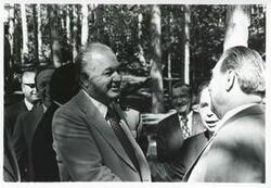 ["Black and white photograph print of Carl Albert, Leonid Brezhnev, John Brademas, Clement Zablocki, and others standing outside in Yalta. House delegation trip. August 1975"]