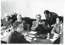 ["Black and white photograph print of Carl Albert, Leonid Brezhnev, and other men seated at a table. House delegation trip. August 1975"]
