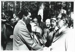 ["Black and white photograph print of Carl Albert and Leonid Brezhnev standing outside with several others. House delegation trip. August 1975"]