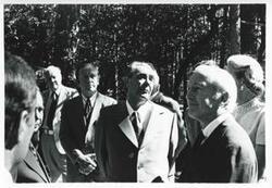 ["Black and white photograph print of Carl Albert, John Brademas, and Leonid Brezhnev standing outside with several others. House delegation trip. August 1975"]