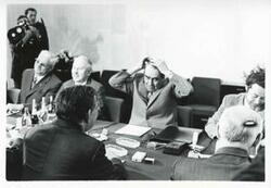 ["Black and white photograph print of Carl Albert seated at a table with Leonid Brezhnev and others. In Yalta for House delegation trip. August 1975"]