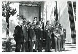 ["Black and white photograph print of Carl Albert, Leonid Brezhnev, and others posing for a picture. House delegation trip. August 1975"]