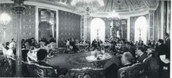 ["Black and white photograph print of Carl Albert and several unidentified people in an elegant room. Russia-House delegation trip. August 1975"]