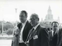 ["Black and white photograph print of Representative Robert Michel standing with another man. House delegation trip. August 1975"]
