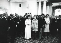 ["Black and white photograph print of Carl Albert standing with an unidentified group of people. House delegation trip. August 1975"]