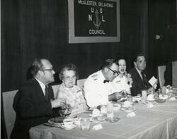["Black and white photograph of a banquet in McAlester, Oklahoma on Armed Forces Day. 1974 Carl Albert shown in 3903 and 3906"]
