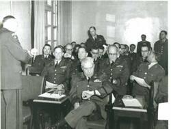 ["Black and white photograph of army reservists in a classroom. All are in service uniform. Carl Albert is in second row."]