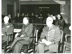 ["Black and white photograph of Carl Albert and other Army reservists seated around a large table."]