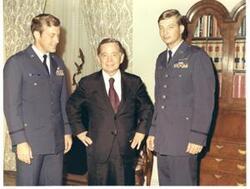 ["Color photograph of Carl Albert with 8-A's (Air Force organization).  Officers last names are Ritchie (left) and Debellevue (right). 1972."]