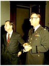 ["Color photograph of Carl Albert shown with an Army lieutenant colonel in Speaker's office. 1972."]