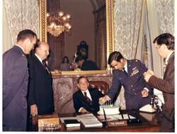 ["Color photograph of Carl Albert with 8-A's (Air Force organization). Robert L. F. Sikes is second from left. Celebrating Air Force 25th anniversary in Speaker's office."]
