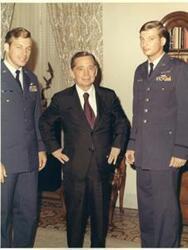 ["Color photograph of Carl Albert with two members of the Air Force's A-6 or A-8? in the Speaker's office.  The surnames of the Officers in the photo are: Ritchie (left) and Debellevue (right)."]