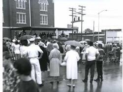 ["Black and white photograph of parade in McAlester, Oklahoma on Armed Forces Day. 1967."]