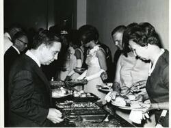 ["Carl Albert in a buffet line at a banquet in McAlester on Armed Forces Day. 1970"]