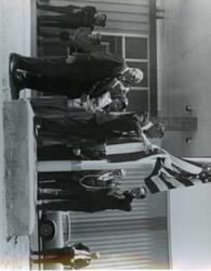 ["Carl Albert, Captain R. M. Hanson, and Mayor Harry Owens riding in a car in a parade in McAlester, Oklahoma on Armed Forces Day. 1968"]