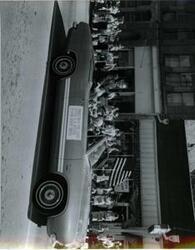 ["Carl Albert, Captain R. M. Hanson, and Mayor Harry Owens shown in a car during a parade in McAlester, Oklahoma on Armed Forces Day. 1968"]