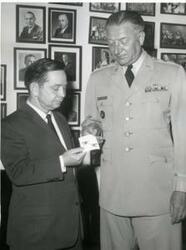 ["Carl Albert presented with colonel insignia by General Vittrup."]