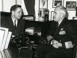 ["Carl Albert with an admiral in Albert's office."]