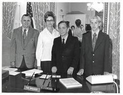["Black and white photograph of Carl Albert with Donald, Chris, and Maxine Yost family in the Speaker's office. 1972"]