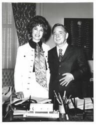 ["Black and white photograph of Carl Albert with Mrs. Joe Cooper of Heavener, Oklahoma."]