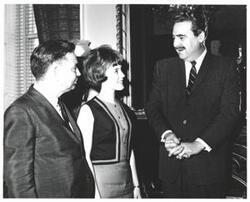 ["Black and white photograph of Carl Albert and unidentified people."]