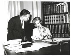 ["Black and white photograph of Carl Albert with unidentified people."]