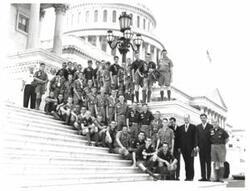 ["Black and white photograph of boy scouts."]