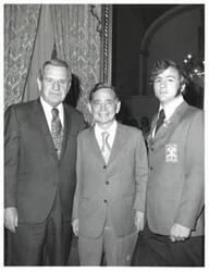 ["Black and white photograph of Carl Albert with a VICA worker and John N. Happy Camp."]