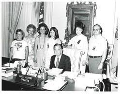 ["Black and white photograph of Carl Albert with the family of the 1975 Journal Spelling Bee winner, Kathy Baxter."]