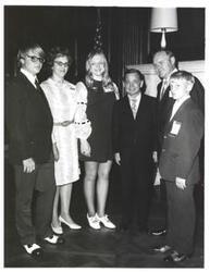 ["Black and white photograph of Carl Albert with unidentified people."]