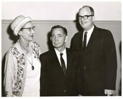 ["Black and white photograph of Carl Albert with unidentified couple."]