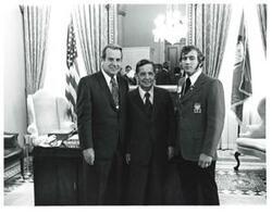 ["Black and white photograph of Carl Albert with VICA representative and John N. Happy Camp (left)."]