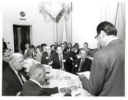 ["Black and white photograph of Richard Hiendlmaye speaking at a 4-H Club award ceremony. May 1974 John N. Happy Camp, Richard Hiendlmaye, Thomas P. O'Neill and W.R. Poage are pictured."]