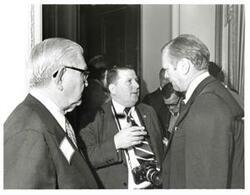 ["Black and white photograph of Photographer speaking to Gerald R. Ford. and Tom Steed. May 1974"]