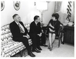 ["Black and white photograph of Carl Albert with unidentified people."]