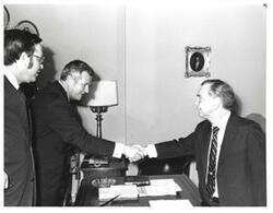 ["Black and white photograph of Carl Albert with two unidentified men."]