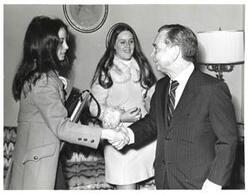 ["Black and white photograph of Carl Albert with two unidentified young adults."]