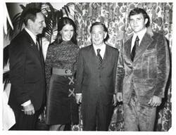 ["Black and white photograph of Carl Albert with unidentified people."]