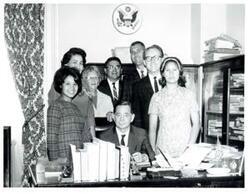["Black and white photograph of Carl Albert with unidentified people."]