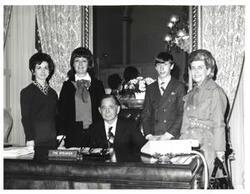 ["Black and white photograph of Carl Albert with unidentified people."]