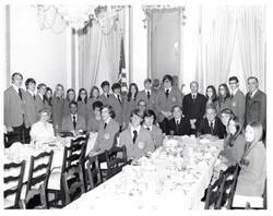 ["Black and white photograph of Carl Albert, James R. Jones and the \"Singing Sooners\" at a luncheon. April 17, 1973"]