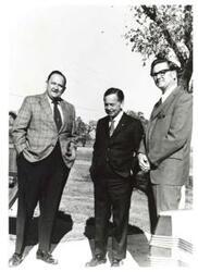 ["Black and white photograph of Carl Albert with two men."]