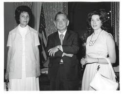 ["Black and white photograph of Carl Albert with unidentified people."]