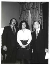 ["Black and white photograph of Carl Albert with unidentified people."]