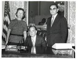 ["Black and white photograph of Carl Albert with unidentified people."]