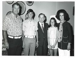 ["Black and white photograph of Carl Albert with unidentified people."]