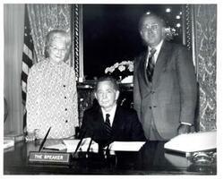 ["Black and white photograph of Carl Albert with unidentified people."]