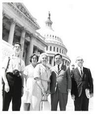 ["Black and white photograph of Carl Albert with the Ed Layne family."]